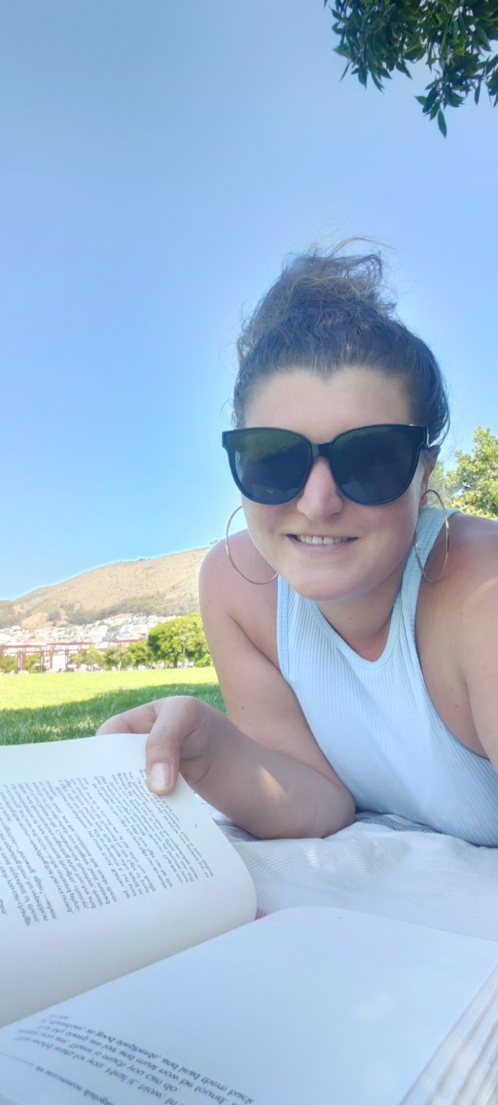 The author reading in a Cape Town park