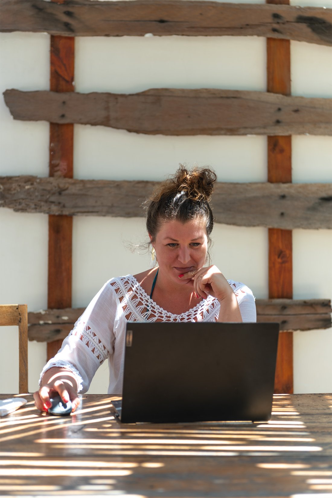 Dunia, founder of Travel Africa Solo, writing on her laptop while travelling.