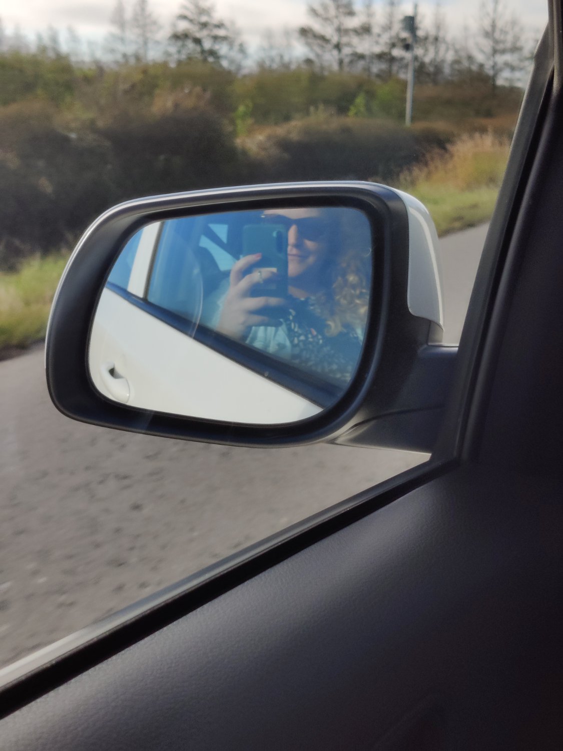 Self-drive road trip, side mirror view