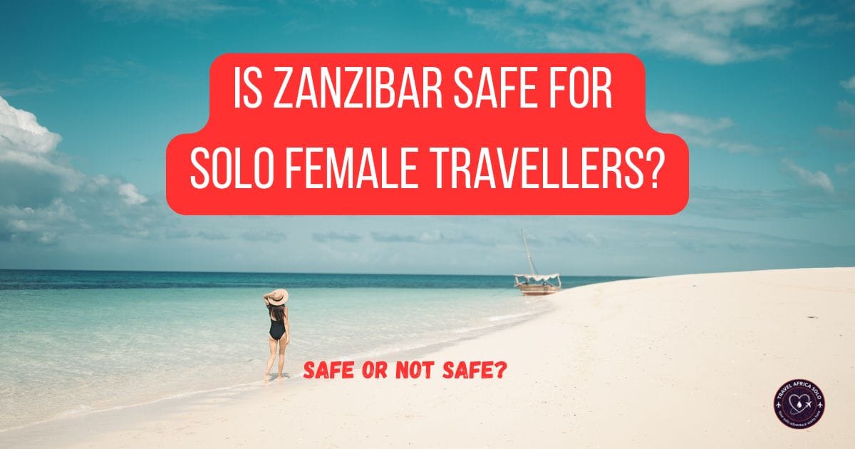 "Is Zanzibar safe for female solo travellers?". A woman in a black swimsuit and sun hat walks on a white sand beach by turquoise water below a bold red headline banner.